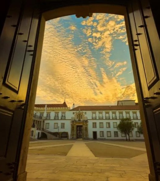 Paço das Escolas seen through the Porta Férrea